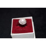 Silver dress ring with large simulated pearl