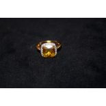 Silver ring with large yellow stone