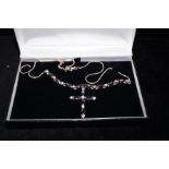 Silver cross and chain set with black gemstones