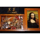 Cuff link collection in a decorative Mona Lisa box