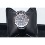 Rue Du Rhone wristwatch. Round black dial with sil