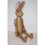 Wooden figure of a rabbit with articulated limbs-