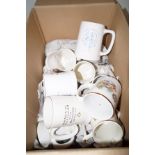 Box of anniversary mugs and others