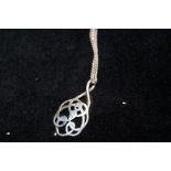 Silver necklace and knotwork pendant