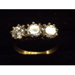 18ct Gold ring with three white stones set in plat