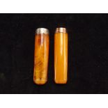 2 cheroot holders, one with a 9ct gold rim and one