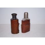 Two vintage leather bound flasks
