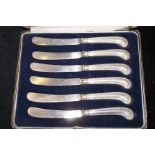 Set of six cased silver butter knifes hallmarked w