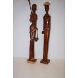 Pair of carved Cuban figures (Tallest: 84cm)