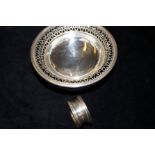 Silver pierced dish together with a silver napkin