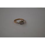 18 carat gold ring set with three illusion cut dia