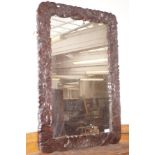 Large oak framed wall mirror, carved with god reli