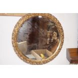 Gilt framed circular bevel edged wall mirror