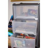 Plastic storage unit containing various CD's