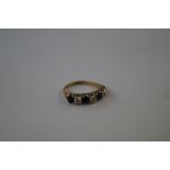 9 carat gold ring set with diamonds and sapphires,