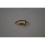 14 carat gold ring set with eleven diamonds, size