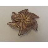 Silver filigree broach in form of a flower