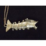 Articulated fish pendant in white metal with white