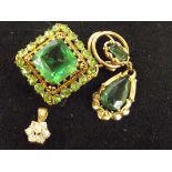 Yellow metal brooch and pendent with green stone t