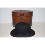 Victorian tin top hat box together with a bowler h