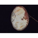 Large yellow metal cameo brooch with safety chain