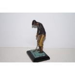 Painted bronze figure of a golfer