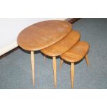 Ercol nest of three pebble tables, elm tops with s