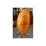 Victorian walnut tilt-top table on bulbous carved