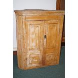 Victorian pine corner cabinet, the doors with fiel