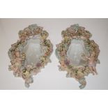 Pair of Continental bevel edge wall mirrors, flora