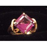 9ct Gold dress ring set with large purple gem ston