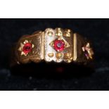 22ct gold ring set with three rubies. Total weight