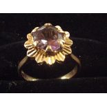 9ct Gold dress ring set with central amethyst. Siz