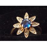 9ct gold flower cluster ring set with central blue