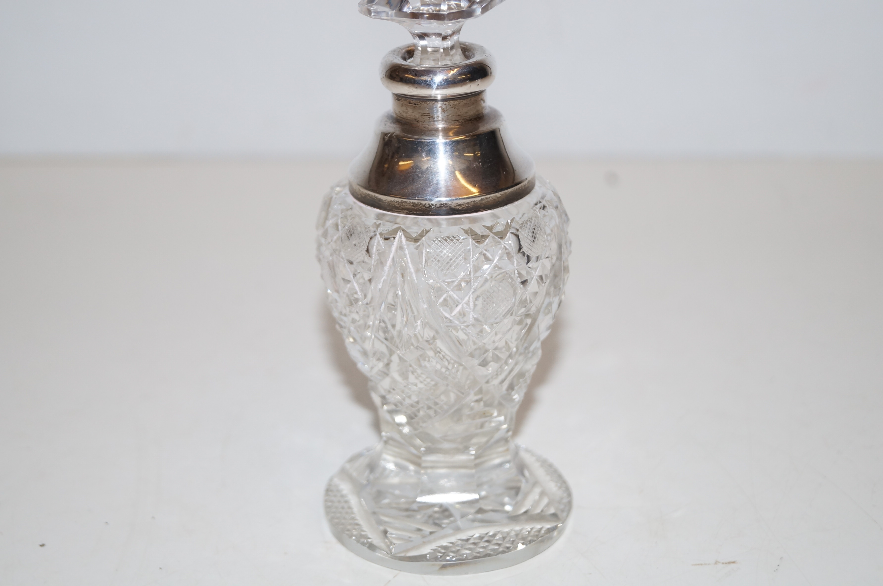 Early silver topped perfume bottle