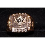 Yellow metal masonic ring surrounded by 20 white s