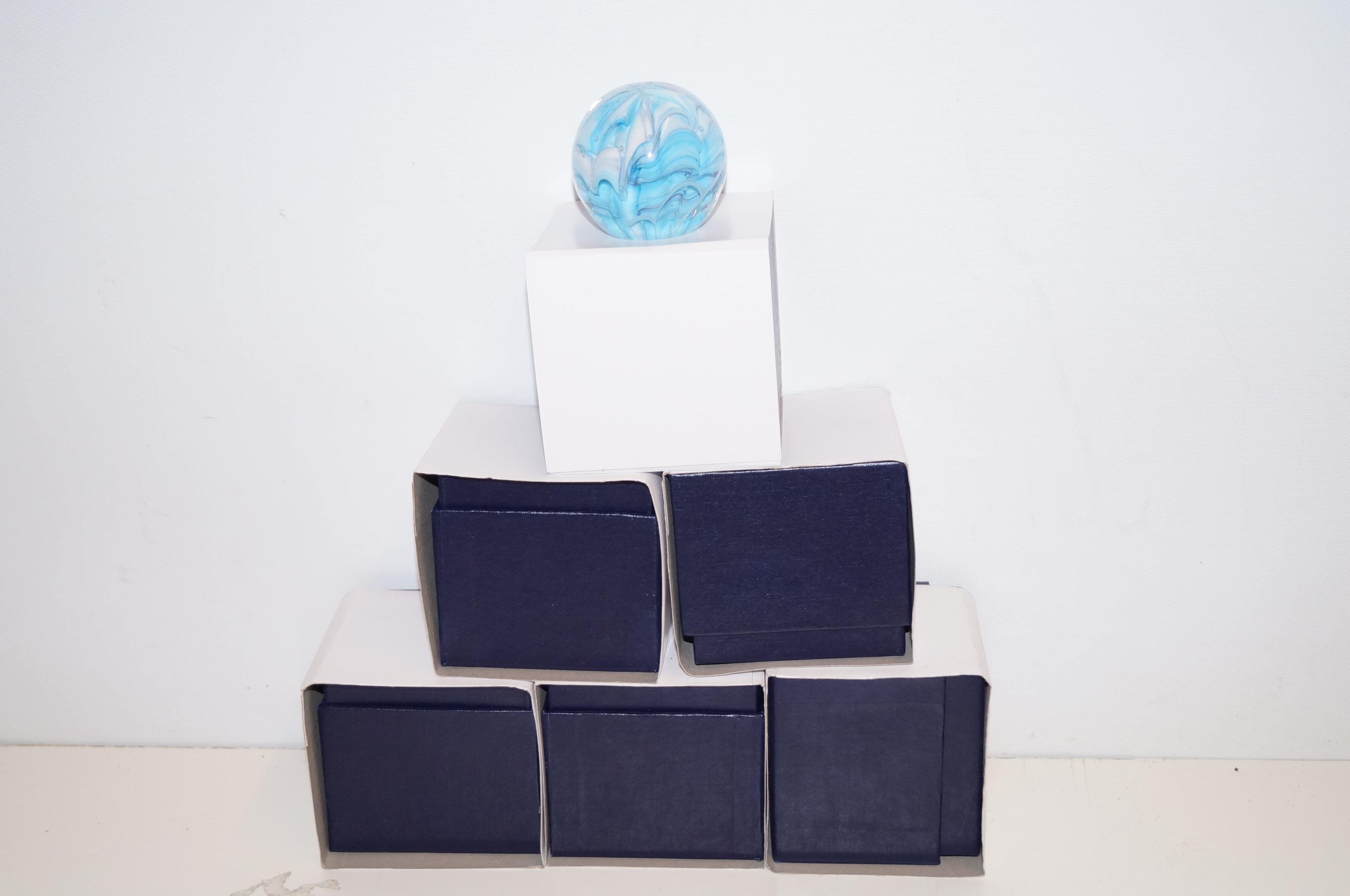 Collection of six boxed paperweights