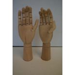 Two wooden articulating hands