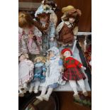 Collection of nine porcelain headed dolls