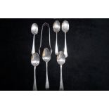 6 Silver spoons together with sugar nips