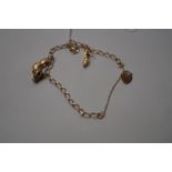 9 carat gold charm bracelet, weight 5.4 grams