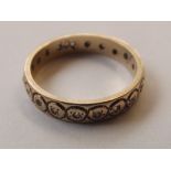 9 carat gold eternity ring set with chip diamonds,