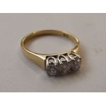 18 carat gold ring set with three diamonds, approx