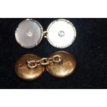 A pair of 18ct gold cufflinks set with diamonds (o