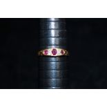 18ct gold ring set with Diamonds x4 and Ruby's x3