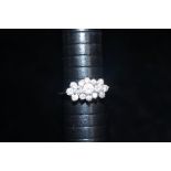 9ct gold cluster ring set with 15 white stones. Si