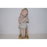 Bisque figure of a young girl. Height 34cm