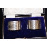 2 boxed silver napkin rings