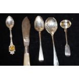 4 silver spoons and a silver fish knife with mothe