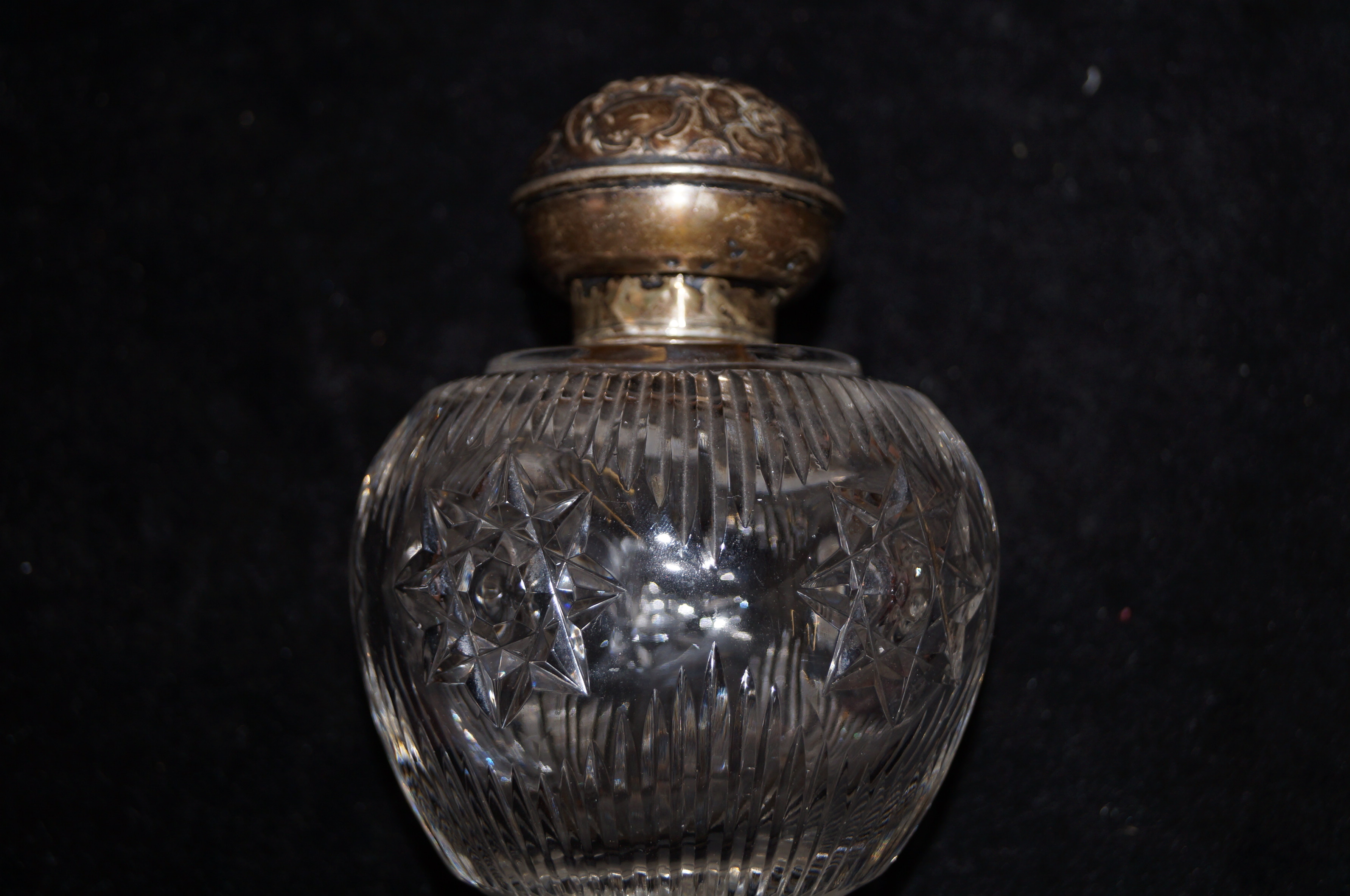 Silver topped scent bottle